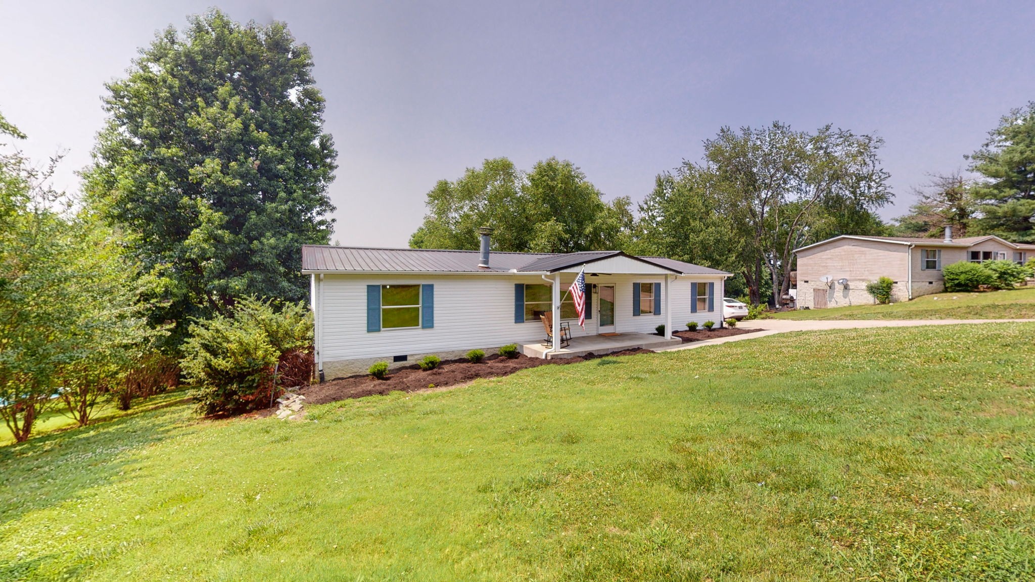 5023 Benders Ferry Road Mount Juliet, TN 37122 - Photo 62 of 62 a front view of house with yard and trees in the background