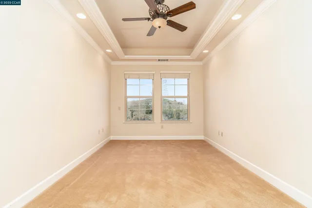 an empty room with a empty space and windows