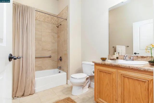 a view of an empty room with a fireplace