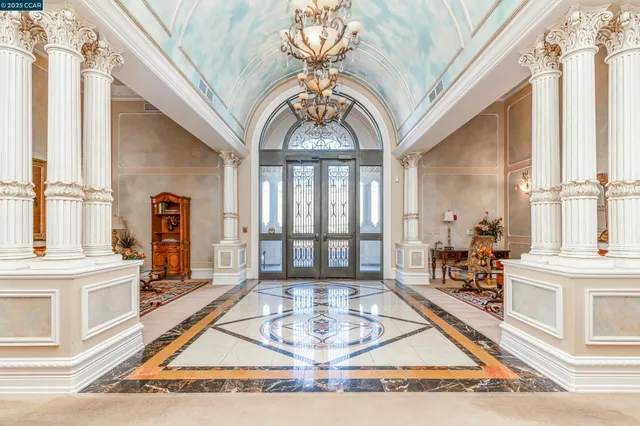 a house with swimming pool and glass windows