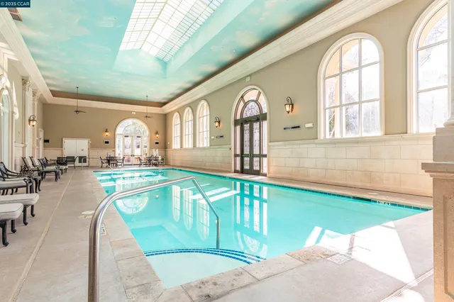 a view of living room with furniture and floor to ceiling window