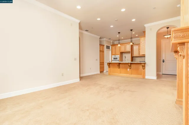 a view of an empty room with a fireplace