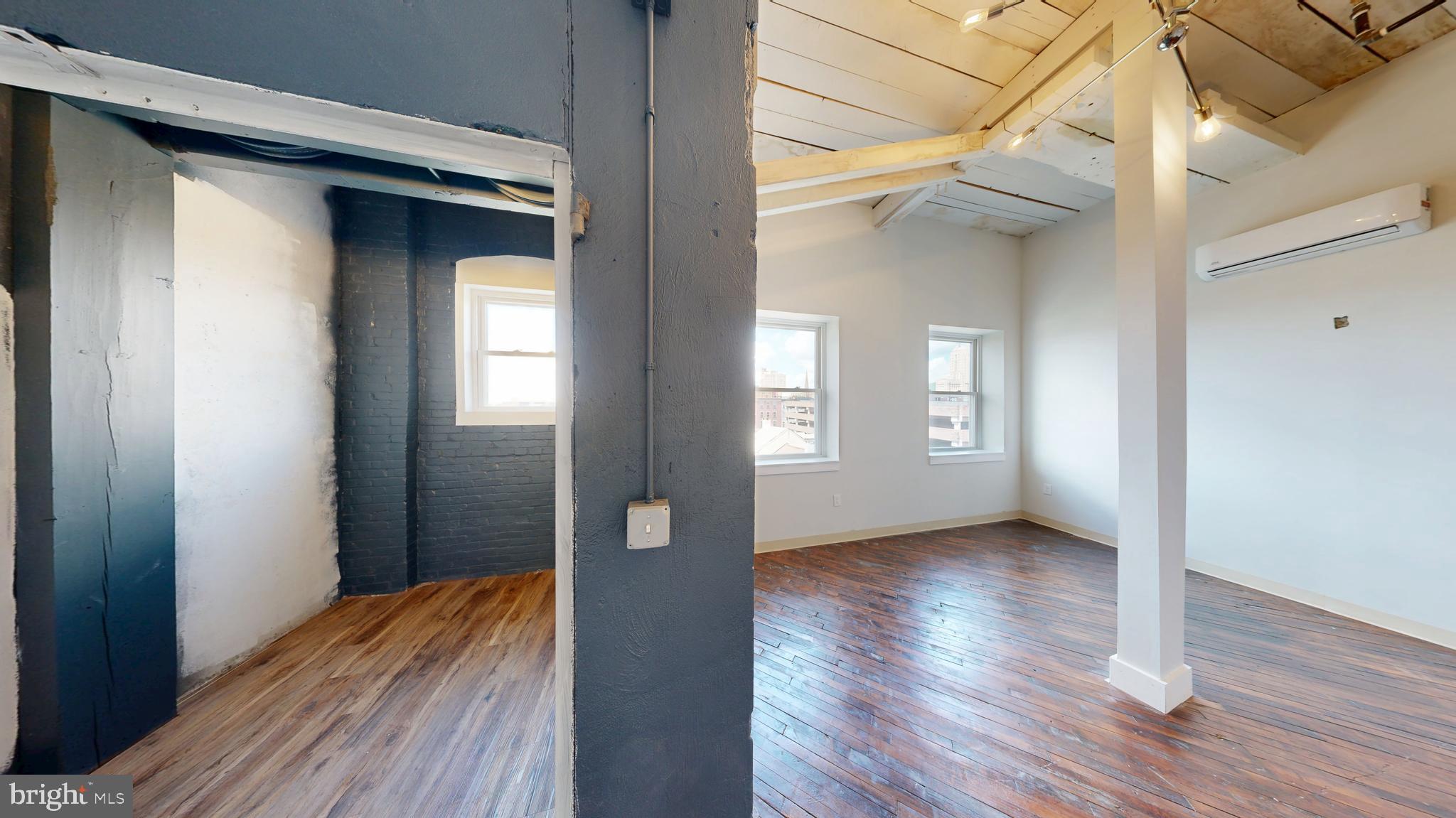 100 South 4th Street, Unit 202 Reading, PA 19602 - Photo 11 of 15 a view of a hallway with wooden floor and closet area