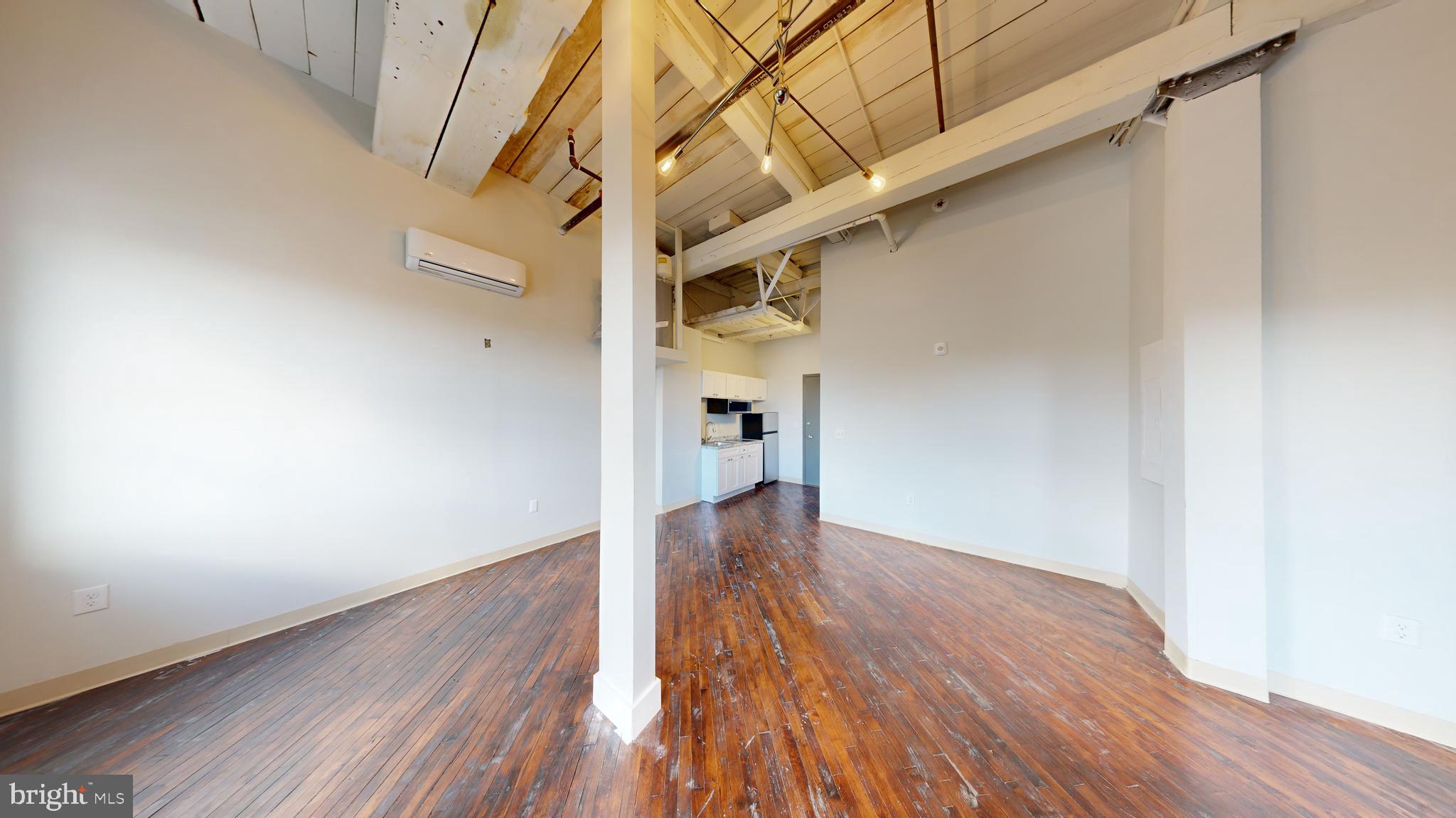 100 South 4th Street, Unit 202 Reading, PA 19602 - Photo 6 of 15 a view of a hallway with wooden floor
