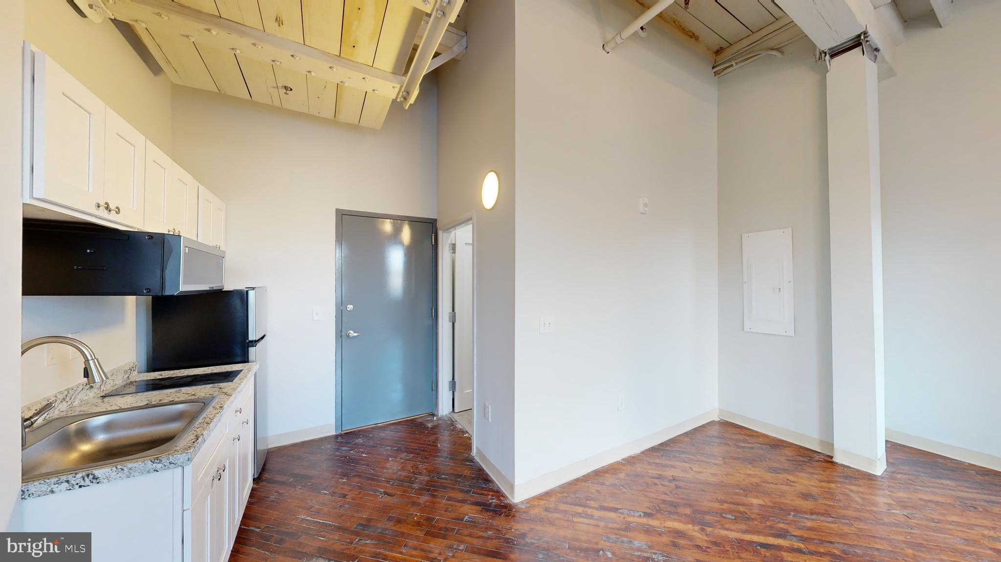 100 South 4th Street, Unit 202 Reading, PA 19602 - Photo 8 of 15 a view of a kitchen with a sink and dishwasher