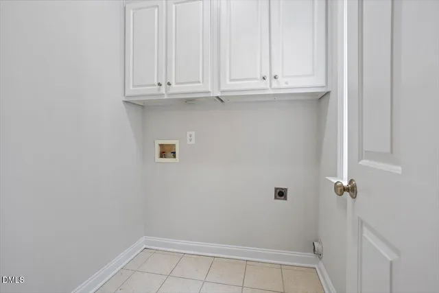 a spacious bedroom with a bed and glass window