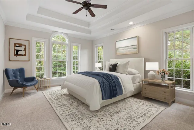 an empty room with windows and ceiling fan