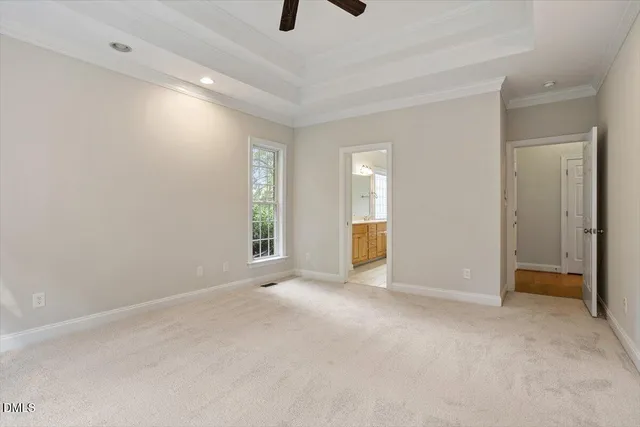 a spacious bathroom with a double vanity sink mirror and bathtub