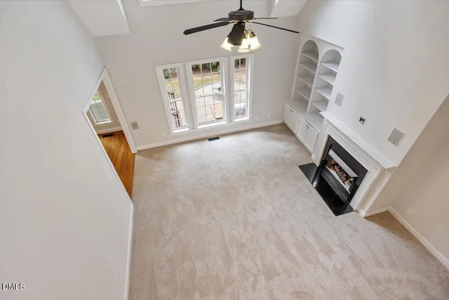 a view of a house with pool and chairs