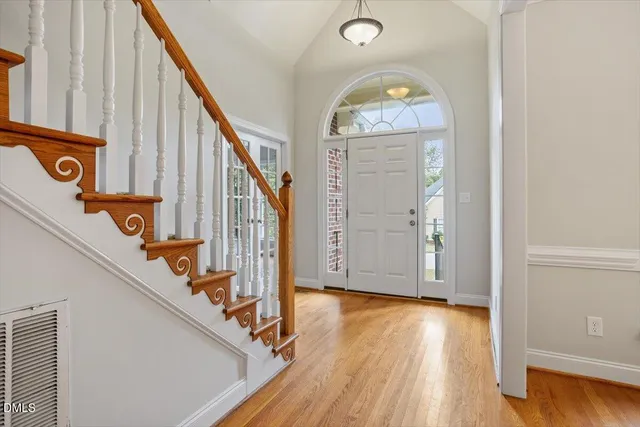 a view of an entryway with wooden floor