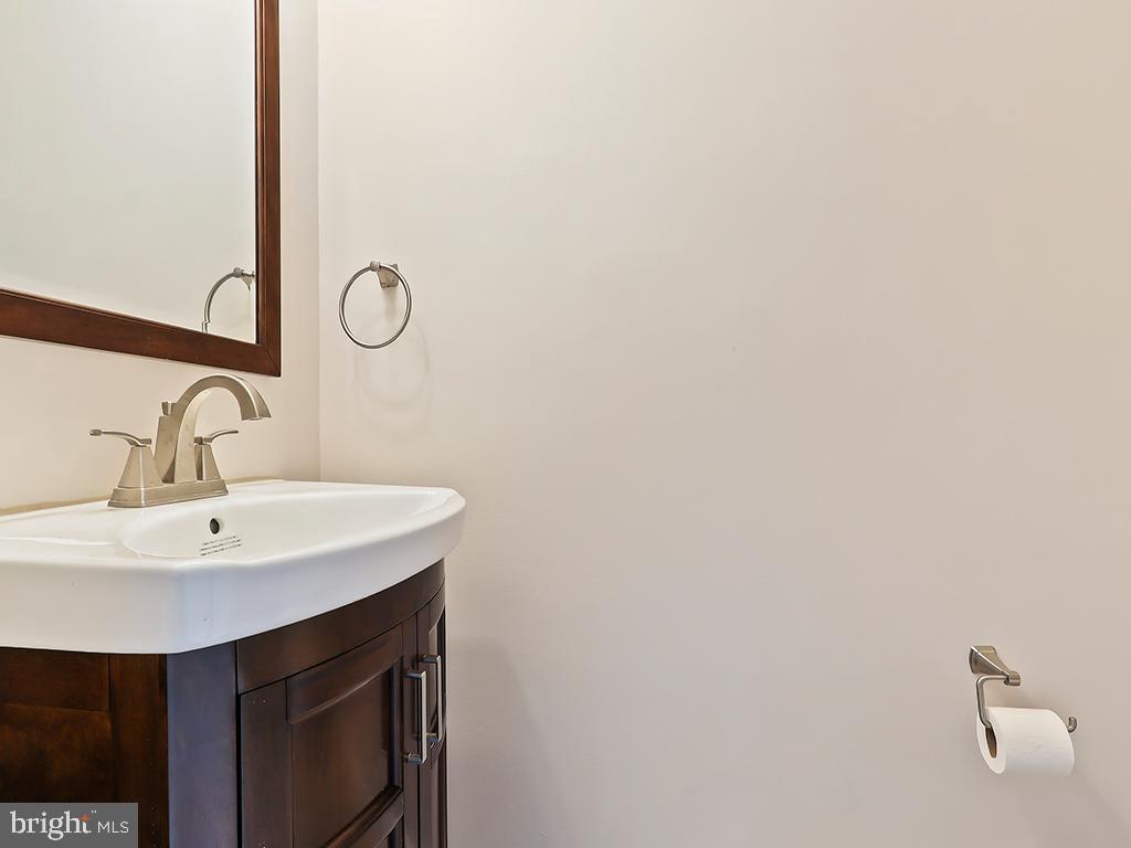 10 Blue Ridge Drive Levittown, PA 19057 - Photo 13 of 31 a utility room with a sink a mirror and vanity