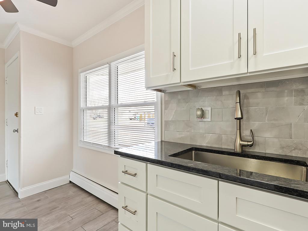 10 Blue Ridge Drive Levittown, PA 19057 - Photo 29 of 31 a kitchen with stainless steel appliances granite countertop white cabinets and a sink