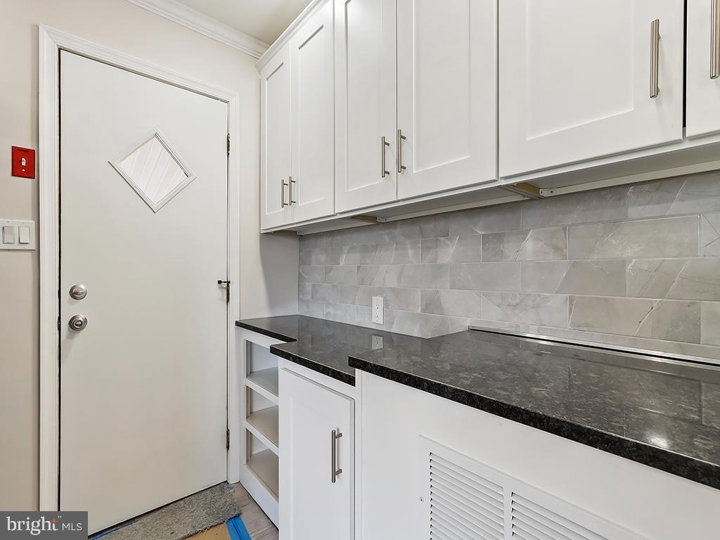 10 Blue Ridge Drive Levittown, PA 19057 - Photo 31 of 31 a kitchen with granite countertop white cabinets and a sink