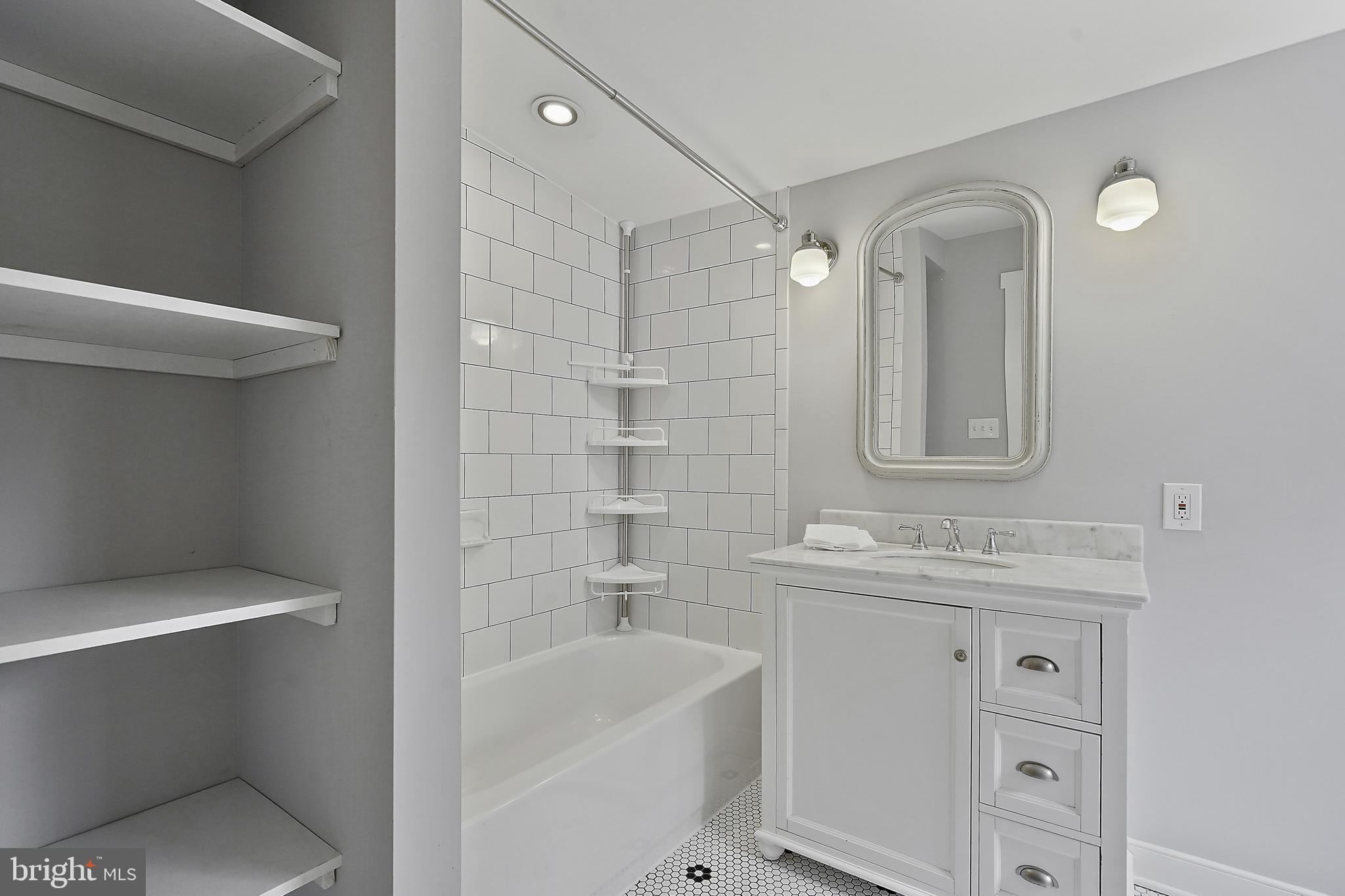 39913 Thomas Mill Road Leesburg, VA 20175 - Photo 15 of 46 a bathroom with a sink a toilet and shower