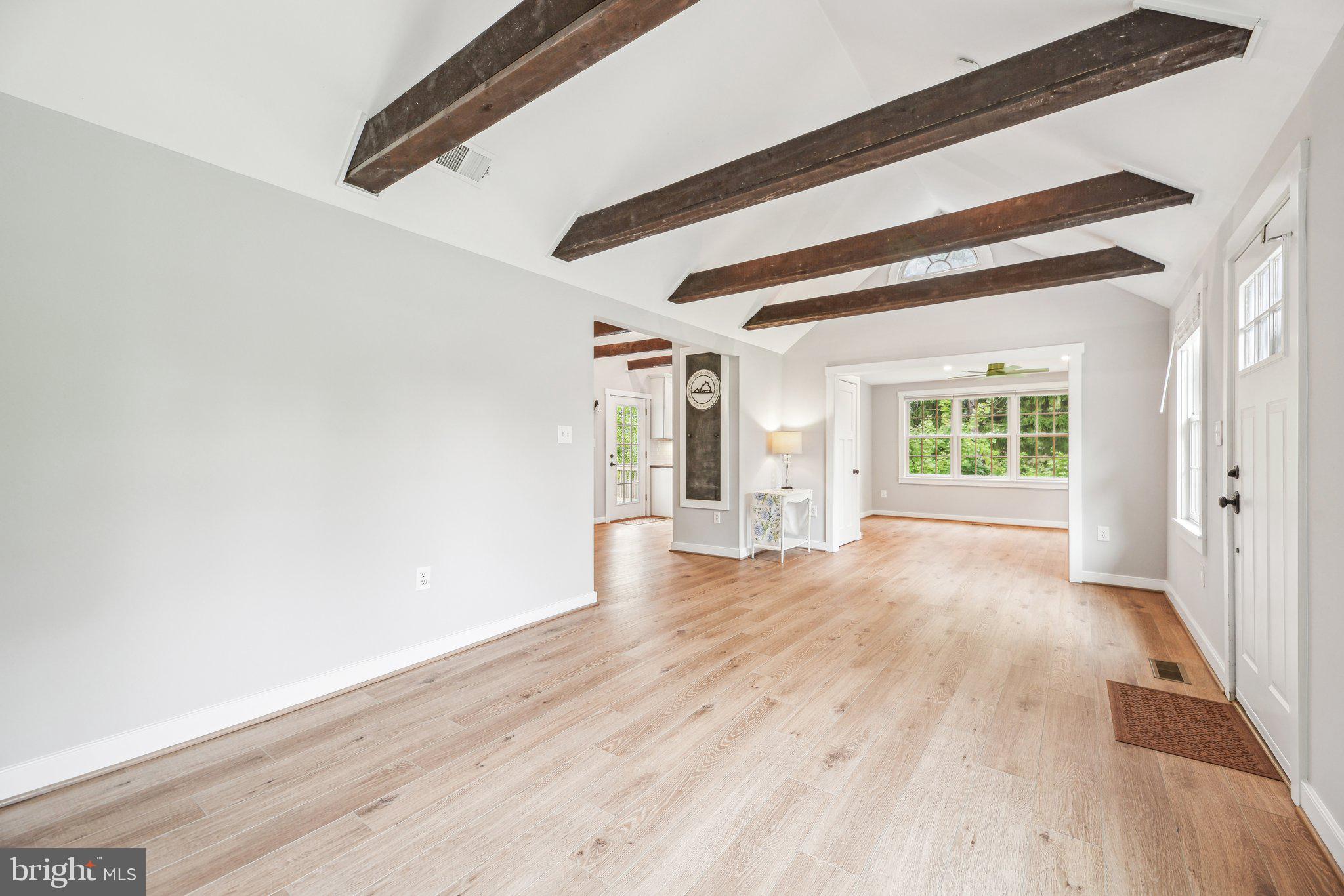 39913 Thomas Mill Road Leesburg, VA 20175 - Photo 18 of 46 a view of an empty room with wooden floor and a window
