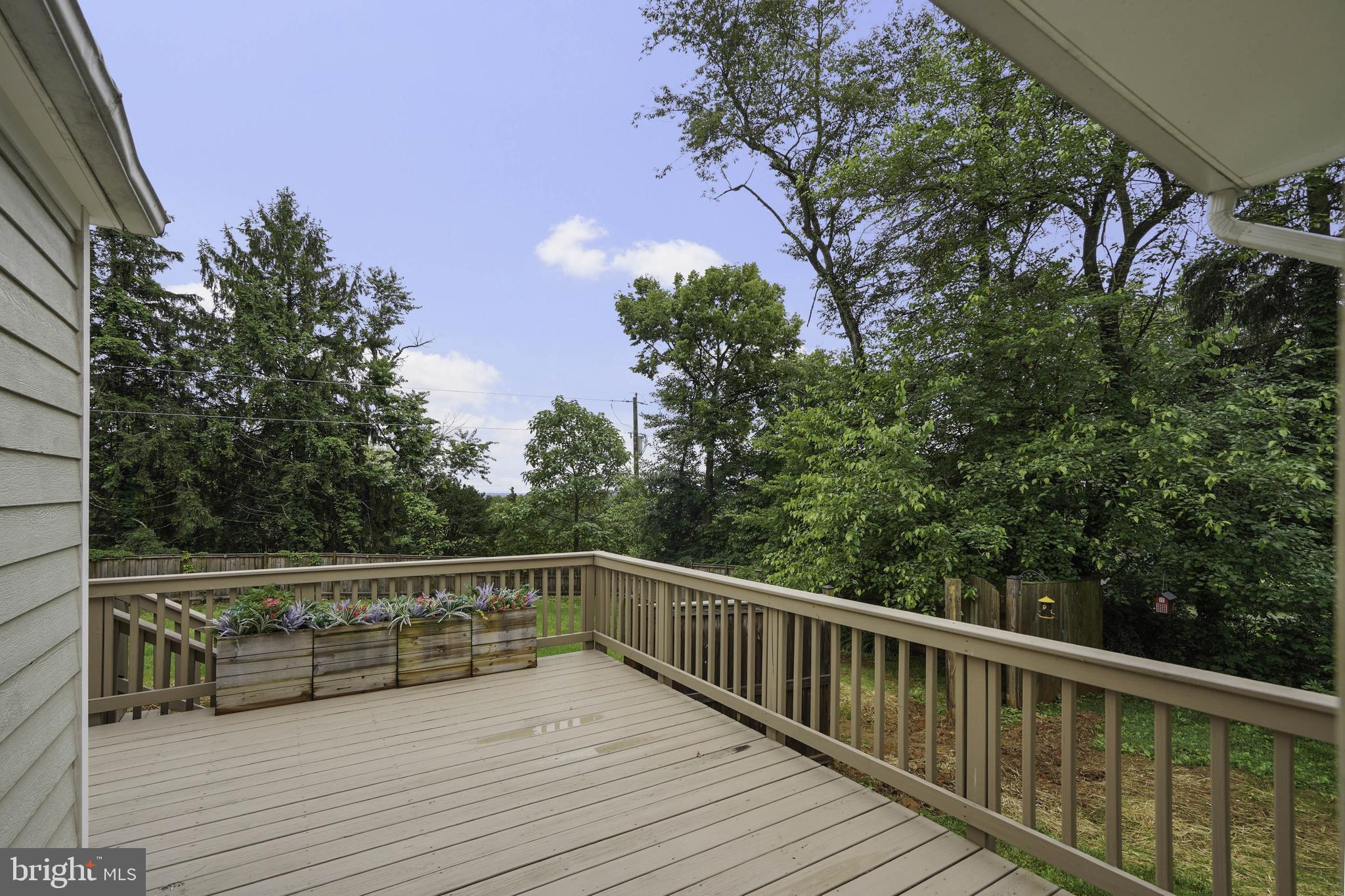 39913 Thomas Mill Road Leesburg, VA 20175 - Photo 2 of 46 a view of balcony with wooden floor and fence