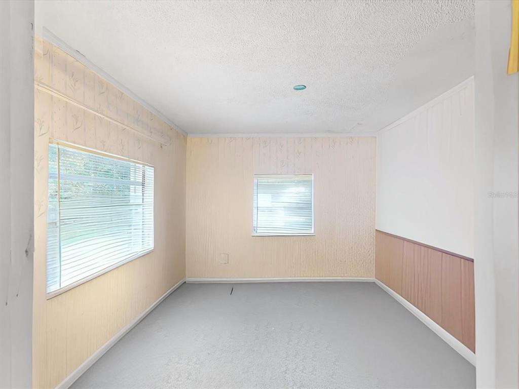420 Jacks Memorial Road St. Cloud, FL 34769 - Photo 16 of 37 an empty room with windows