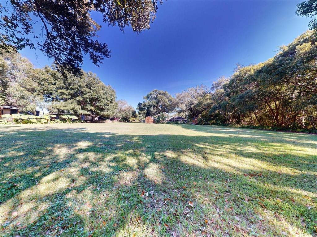 420 Jacks Memorial Road St. Cloud, FL 34769 - Photo 29 of 37 a view of a golf course with a lake