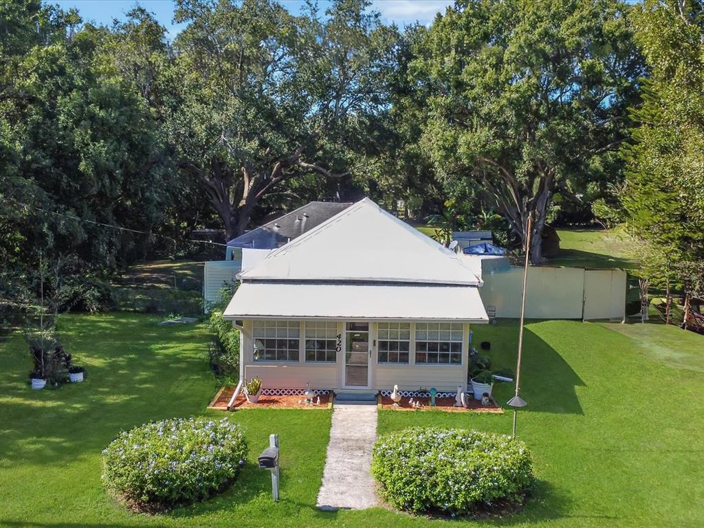 420 Jacks Memorial Road St. Cloud, FL 34769 - Photo 33 of 37 a aerial view of a house with a yard table and chairs