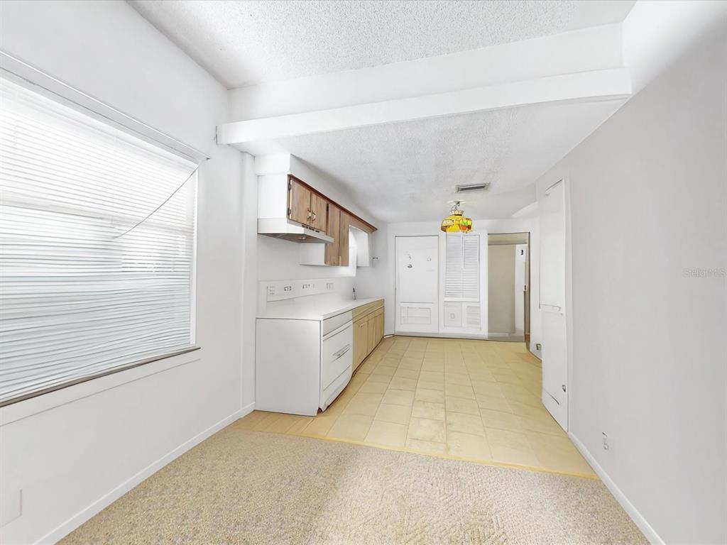 420 Jacks Memorial Road St. Cloud, FL 34769 - Photo 10 of 37 a view of a hallway to rooms and stairs