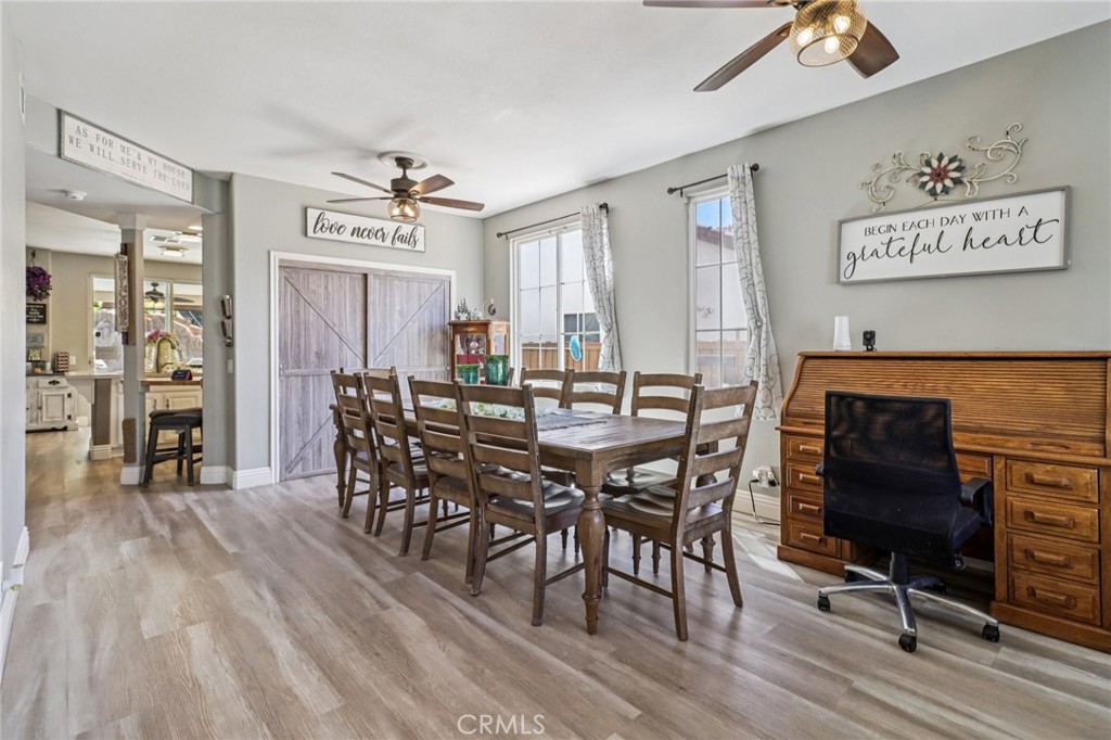 31461 Congressional Drive Temecula, CA 92591 - Photo 15 of 69 a view of a a dining room with furniture window and wooden floor