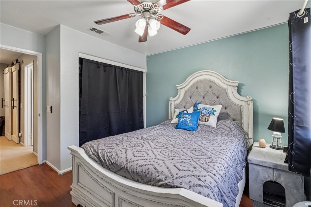31461 Congressional Drive Temecula, CA 92591 - Photo 27 of 69 a bedroom with a bed and ceiling fan