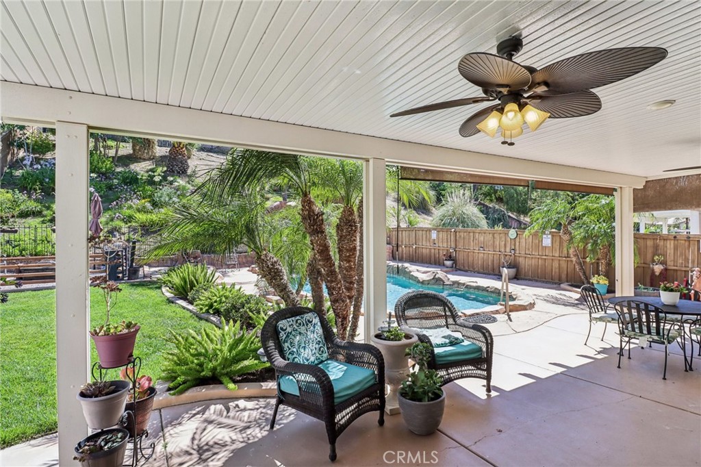 31461 Congressional Drive Temecula, CA 92591 - Photo 3 of 69 a living room with patio furniture potted plant and a large window