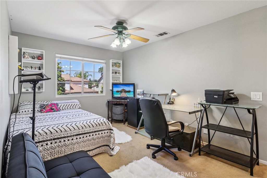 31461 Congressional Drive Temecula, CA 92591 - Photo 35 of 69 a bedroom with a bed and furniture