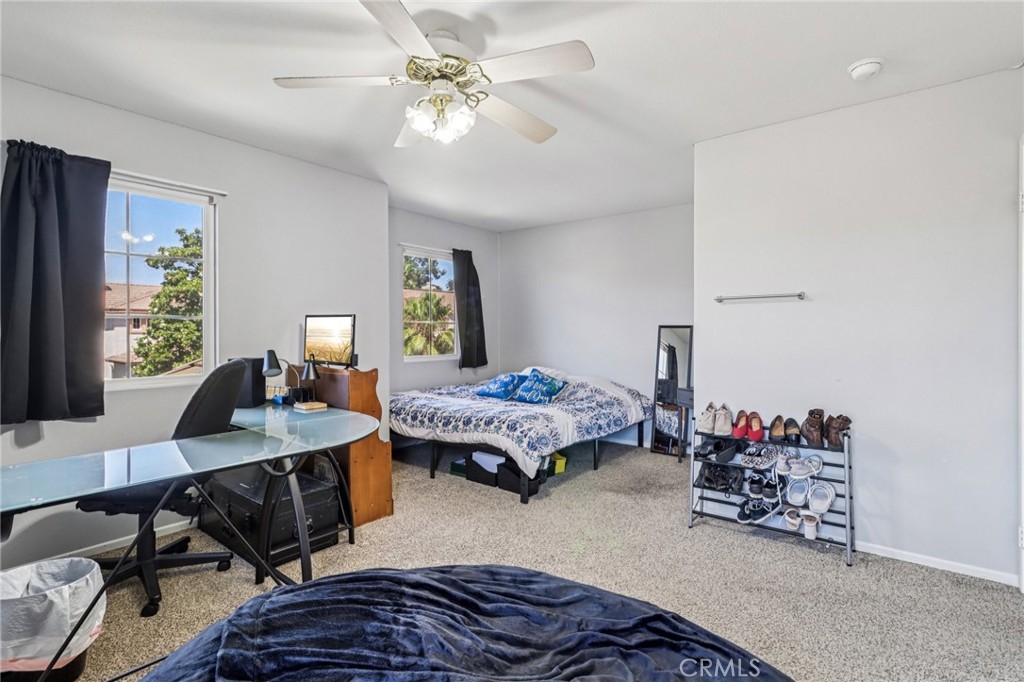 31461 Congressional Drive Temecula, CA 92591 - Photo 38 of 69 a bedroom with furniture and a chandelier