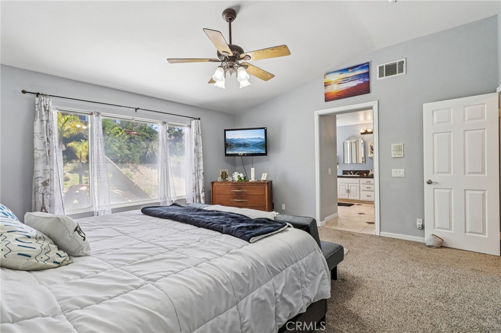 31461 Congressional Drive Temecula, CA 92591 - Photo 43 of 69 a bedroom with a large bed and a window