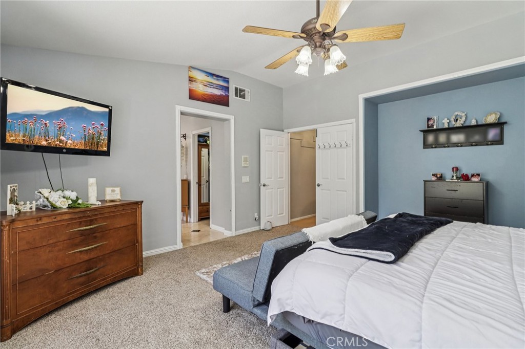 31461 Congressional Drive Temecula, CA 92591 - Photo 44 of 69 a bedroom with a bed and a flat screen tv