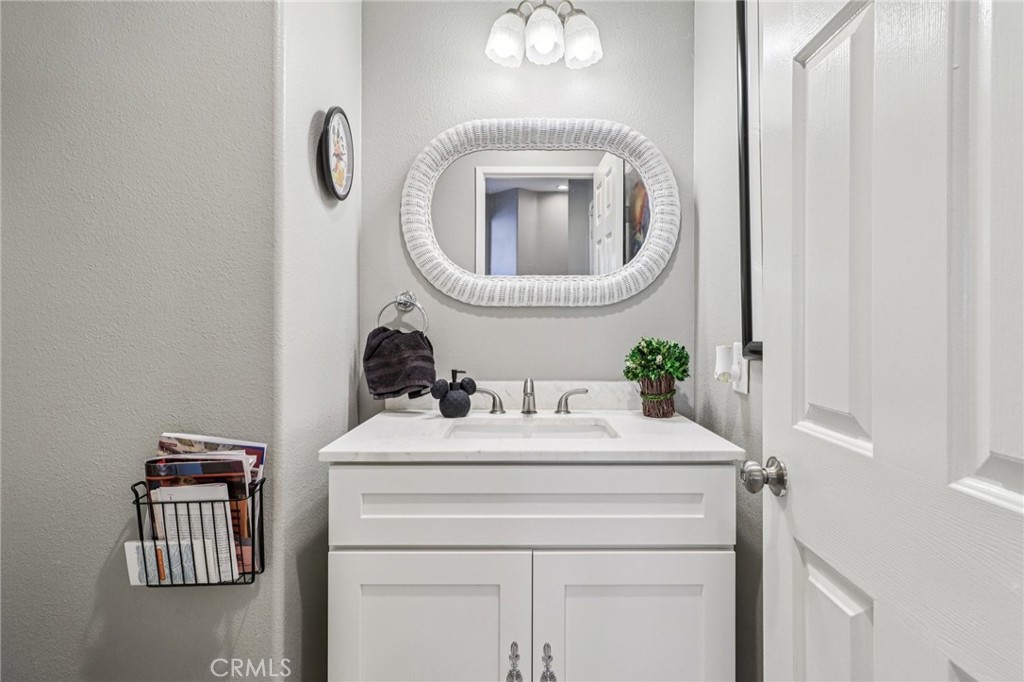 31461 Congressional Drive Temecula, CA 92591 - Photo 52 of 69 a bathroom with a sink and a mirror