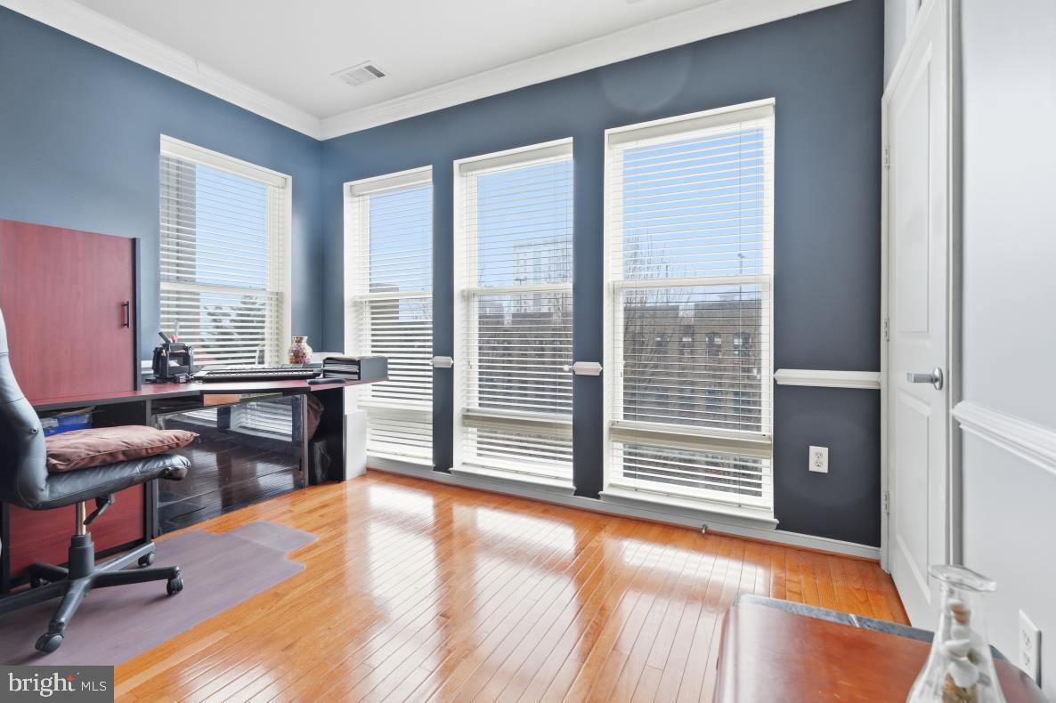 8045 Newell Street, Unit 423 Silver Spring, MD 20910 - Photo 10 of 26 a view of a livingroom with workspace and dining room