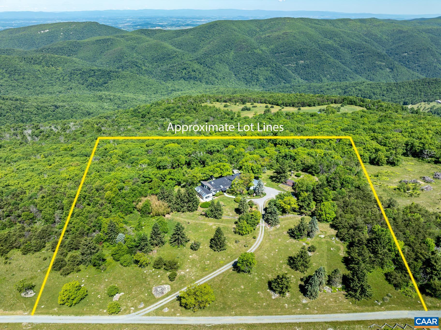 7098 Bucks Elbow Mountain Road Crozet, VA 22932 - Photo 2 of 57 a view of a big yard with lots of green space