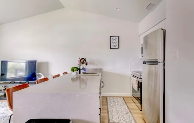 a bed room with a bed and a television