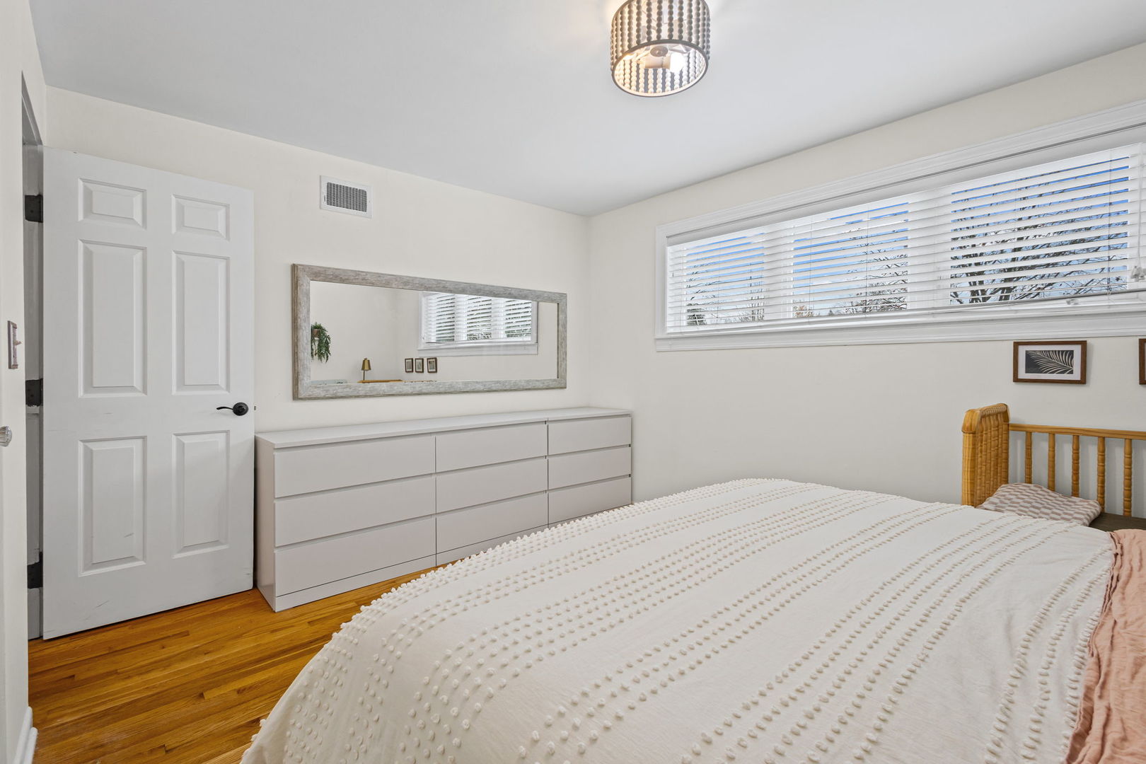 42 West Taylor Road Lombard, IL 60148 - Photo 15 of 36 a bedroom with a bed and a chandelier