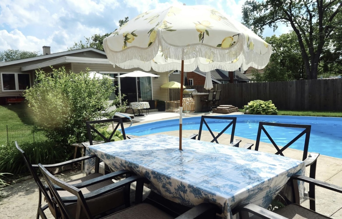 42 West Taylor Road Lombard, IL 60148 - Photo 29 of 36 a wooden bench sitting in front of a building