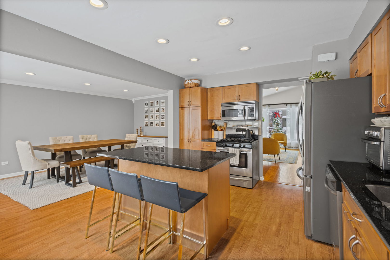 42 West Taylor Road Lombard, IL 60148 - Photo 9 of 36 a kitchen with stainless steel appliances kitchen island granite countertop a table and chairs in it