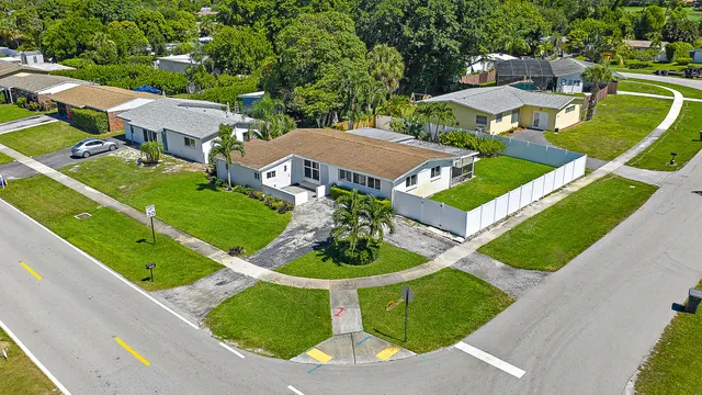 an aerial view of a house with a swimming pool