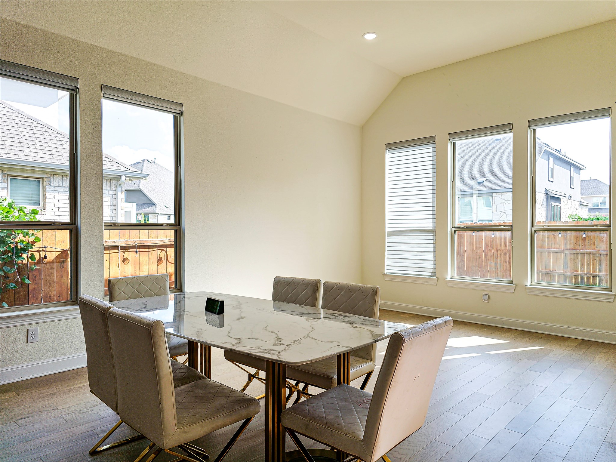 813 Sunny Ridge Drive Leander, TX 78641 - Photo 17 of 32 A luminous dining area offers abundant natural illumination through multiple windows, perfect for memorable meals.