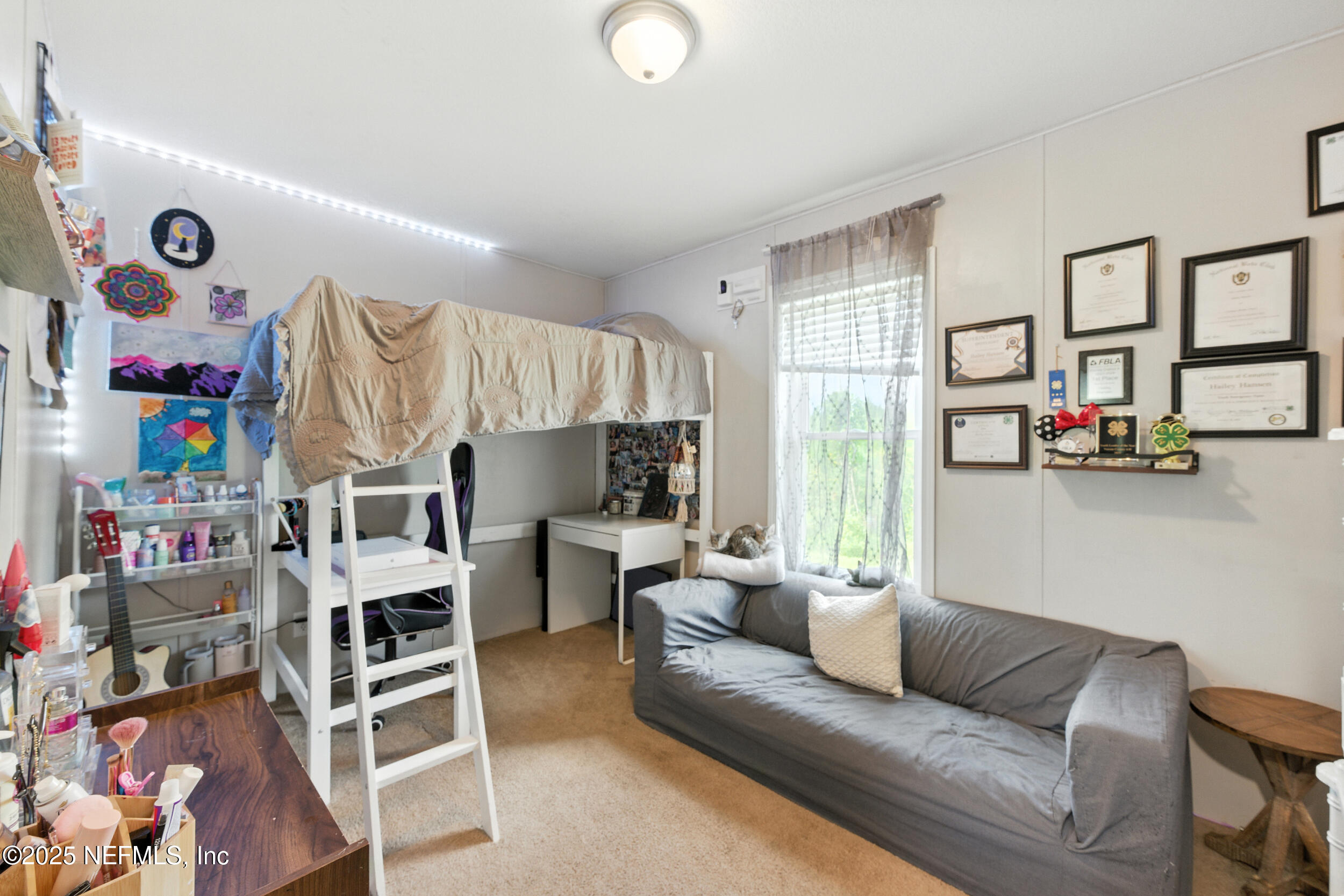 44586 Maplewood Court Callahan, FL 32011 - Photo 11 of 20 a living room with furniture and a flat screen tv