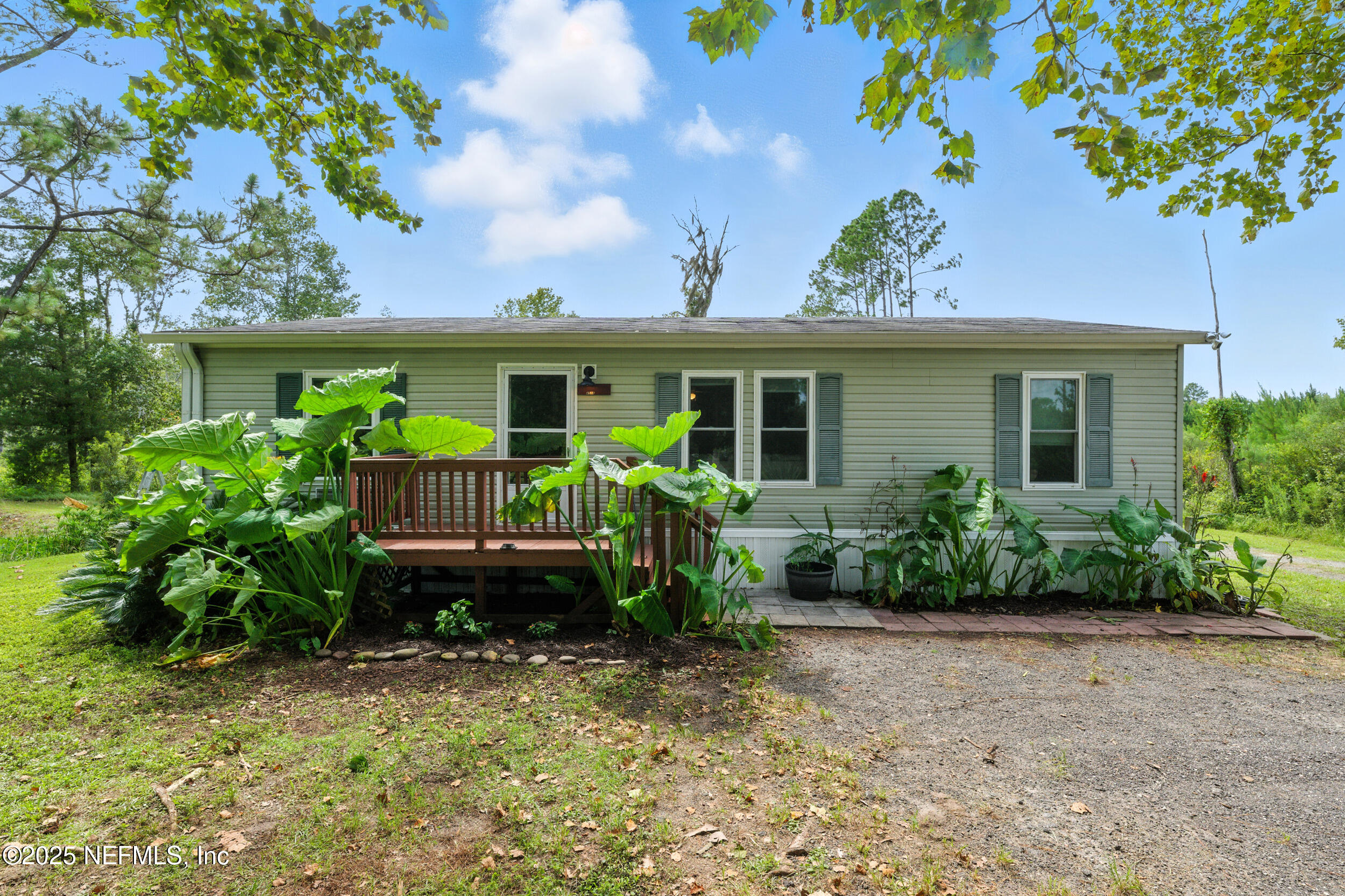 44586 Maplewood Court Callahan, FL 32011 - Photo 3 of 20 a view of a house with a chairs in patio