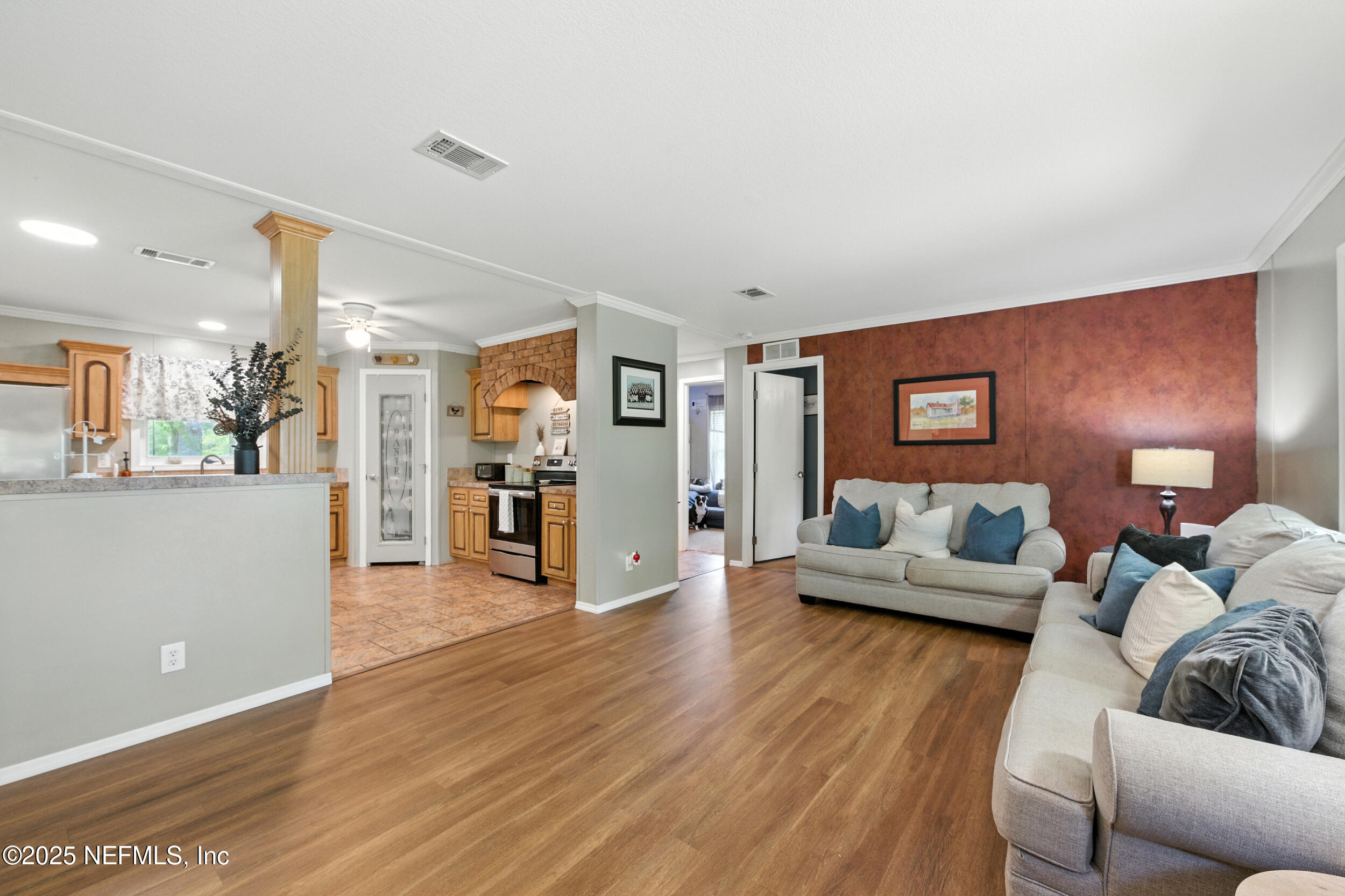 44586 Maplewood Court Callahan, FL 32011 - Photo 7 of 20 a living room with furniture and a wooden floor