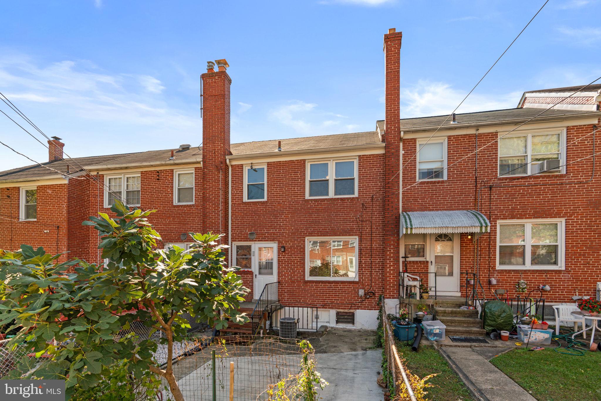 1420 Cedarcroft Road Baltimore, MD 21239 - Photo 25 of 28 a front view of a house with garden