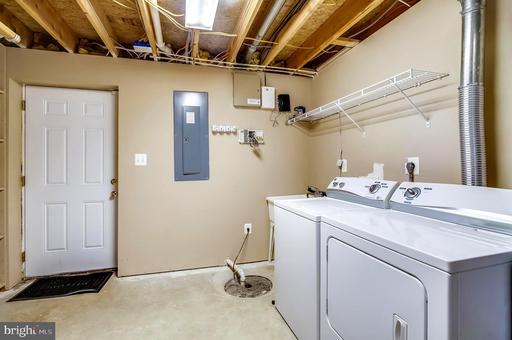 1662 Cape May Road Baltimore, MD 21221 - Photo 23 of 37 Large Laundry Room w/access to outside