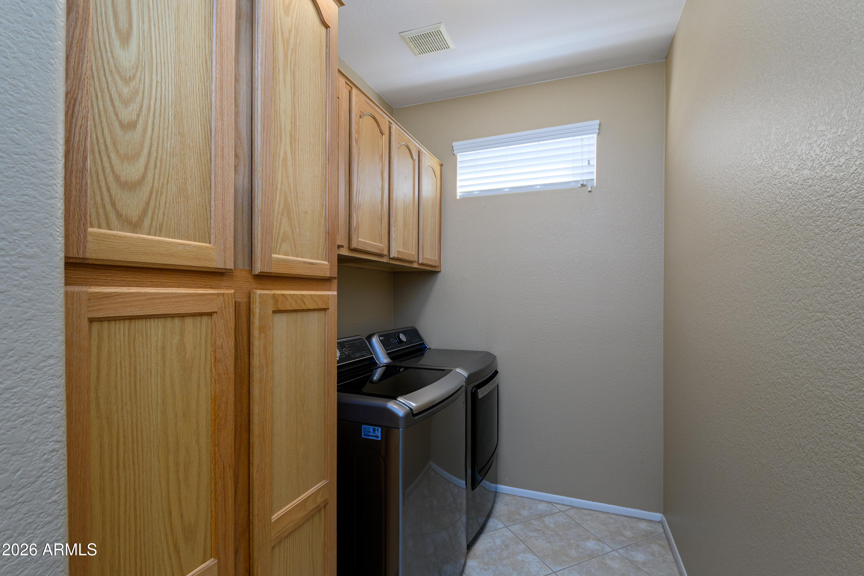 15069 West Double Tree Way Surprise, AZ 85374 - Photo 24 of 36 Laundry Room Cabinets