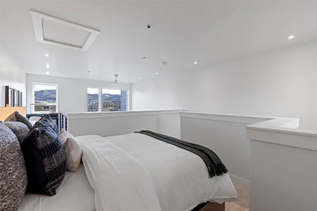 a bedroom with a bed and window