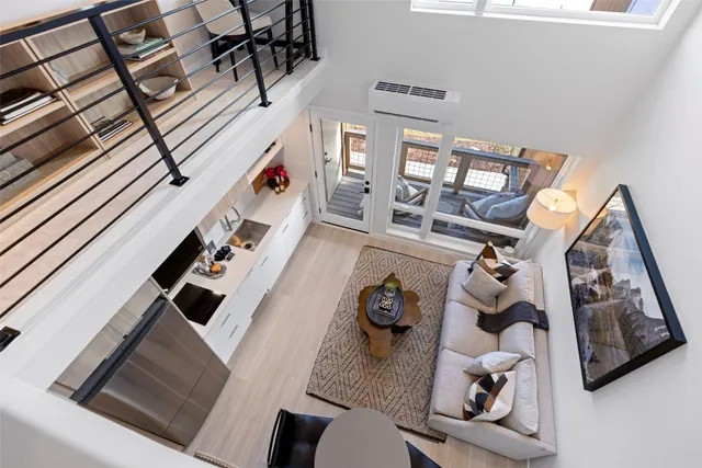 a view of living room with furniture and a rug