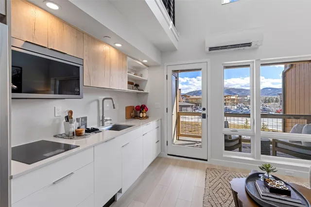 a kitchen with a sink cabinets and a window