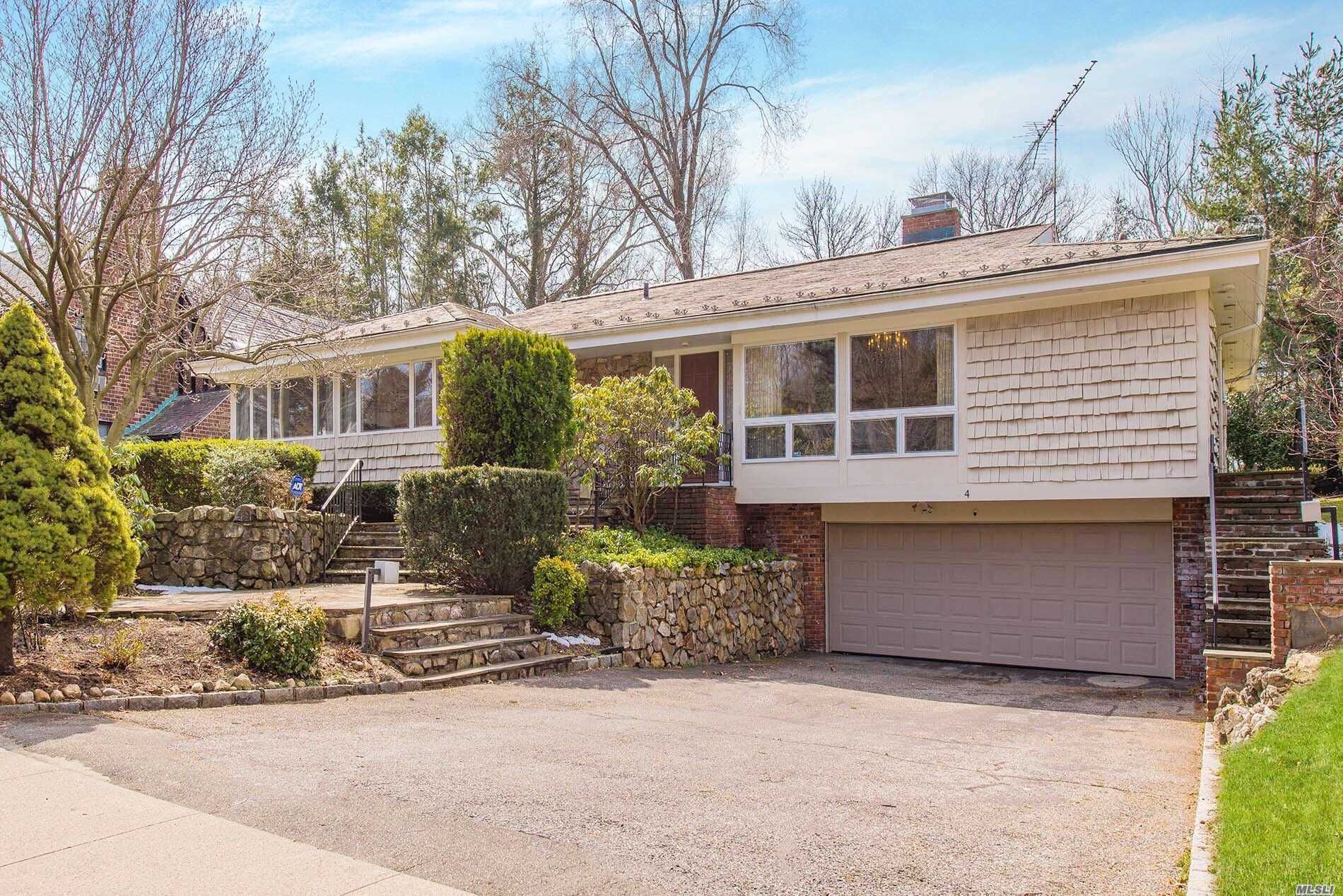 4 Surrey Road Great Neck, NY 11020 - Photo 1 of 1 front view of house with a yard